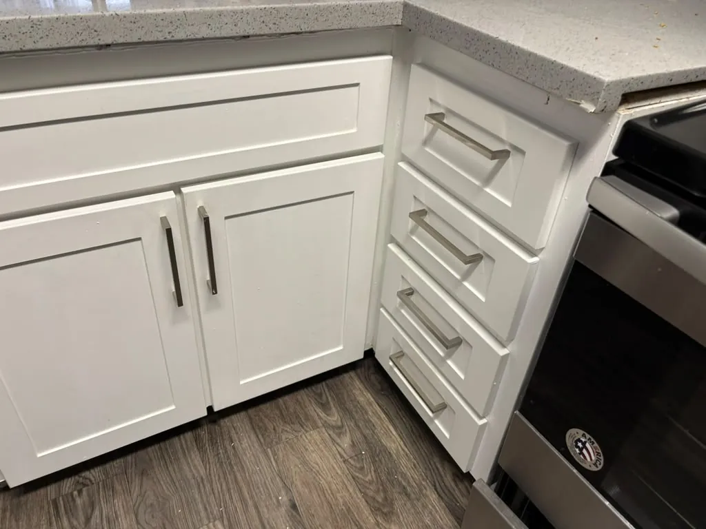 White kitchen cabinets installed in a remodel