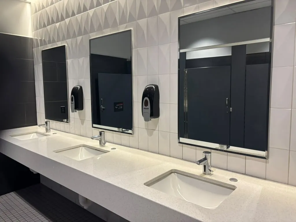 Commercial bathroom with double vanities remodeled