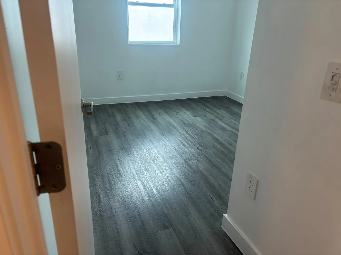 Freshly painted room with new flooring installed